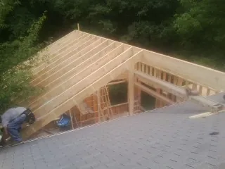 Framing a new roof addition that ties into an existing shingle roof in White Marsh
